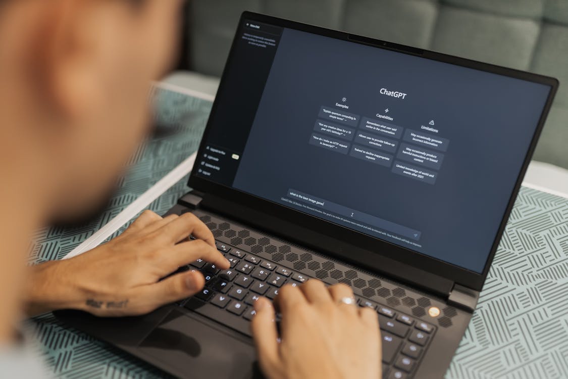 Man typing a query on ChatGPT