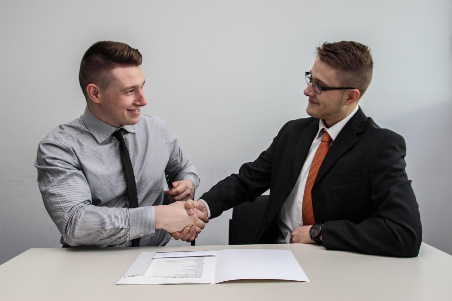 Men handshaking for partnership examples