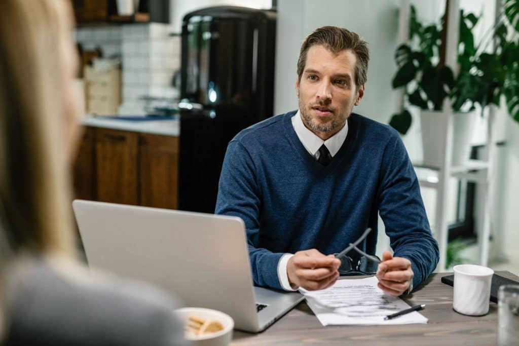 A financial advisor explains the fixed interest rates and terms of personal loans to a client.