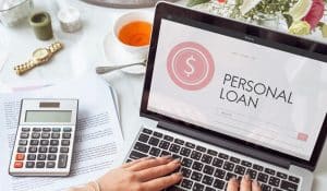 Person viewing personal loan on their laptop.