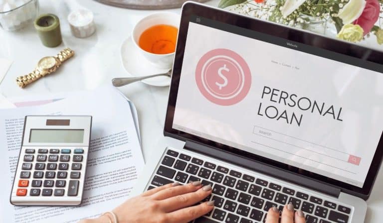 Person viewing personal loan on their laptop.