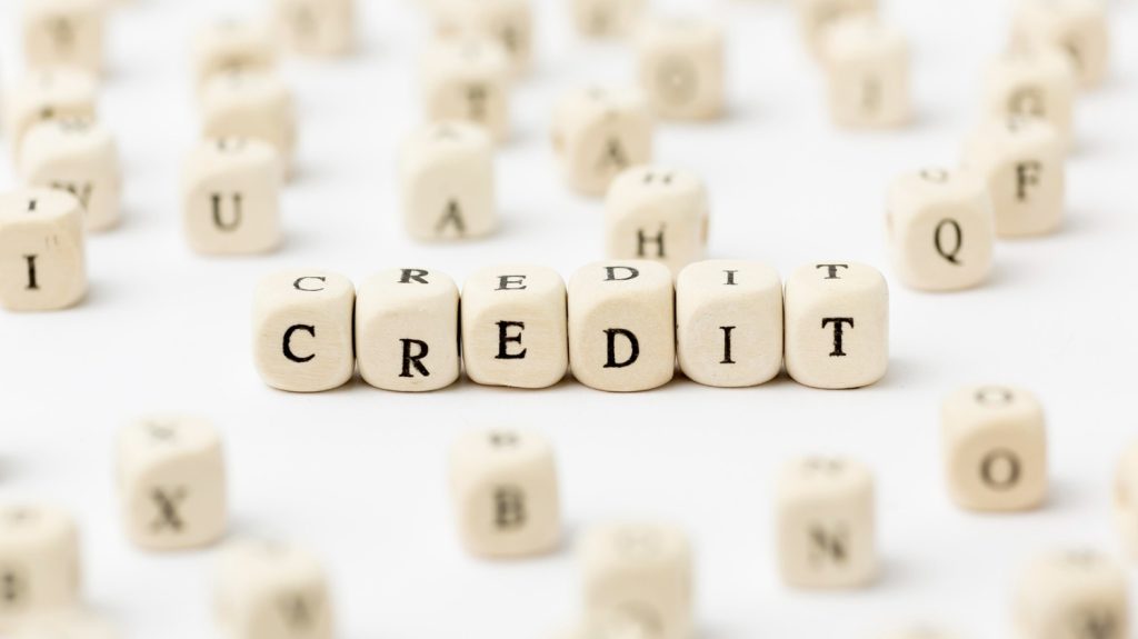 Credit written in scrabble letters