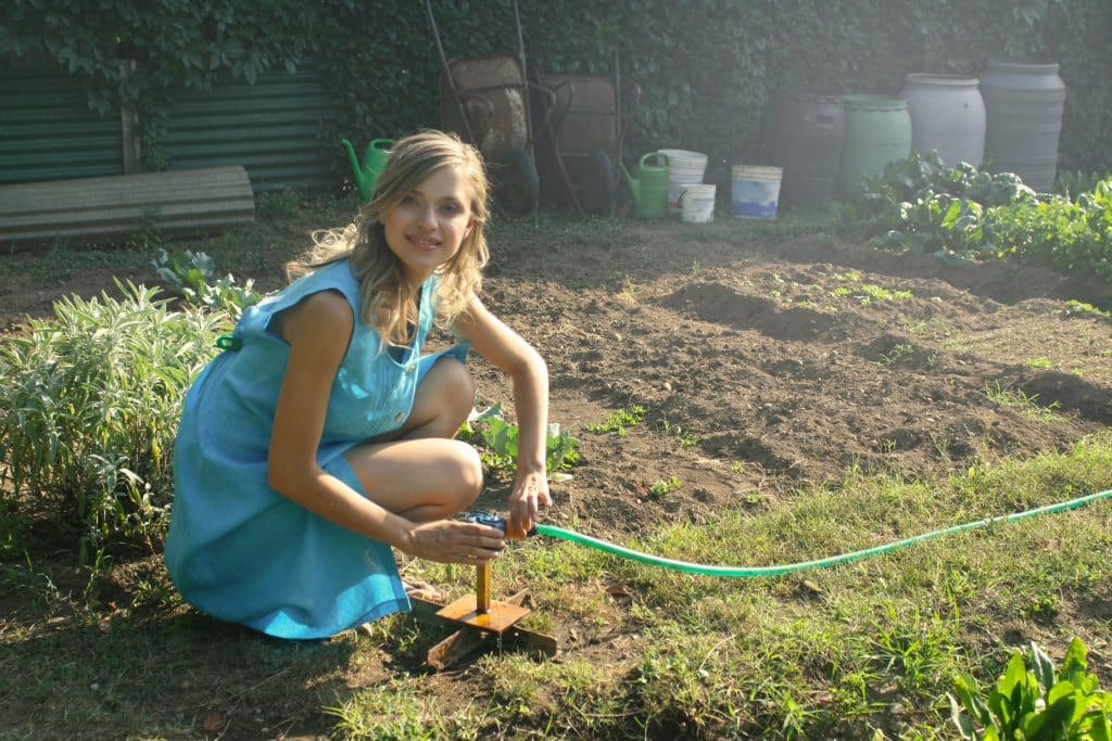 Woman gardening in a homestead