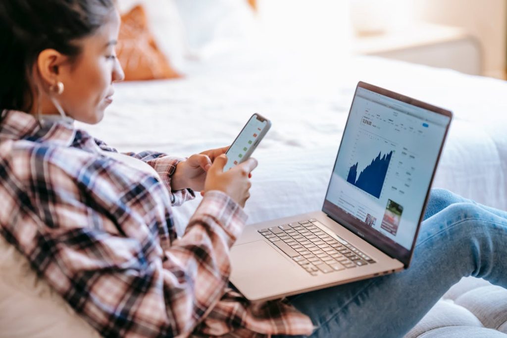 Person checking their investment and hybrid annuity in a laptop