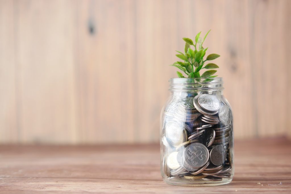 Coins inside a jar for savings on how to prepare for long-term care