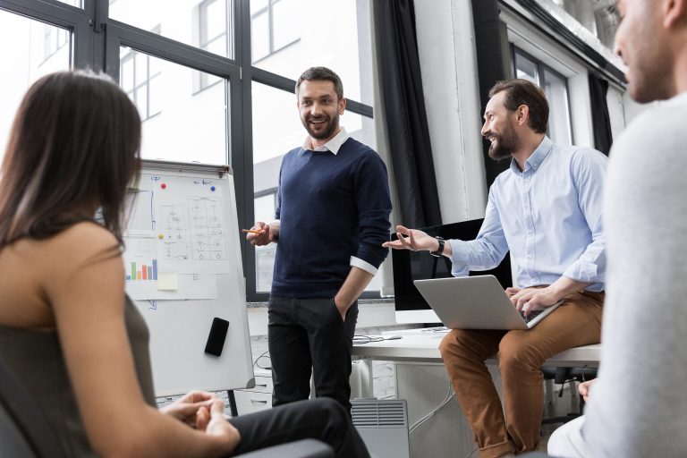 Business coworkers discussing new ideas including a pure play approach