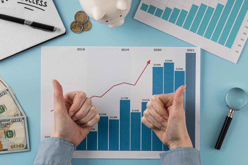 Top view of residual value data on paper with person giving thumbs up