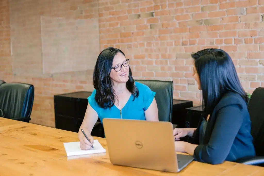 Two women discussing fiduciary bond
