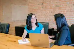 Two women discussing fiduciary bond
