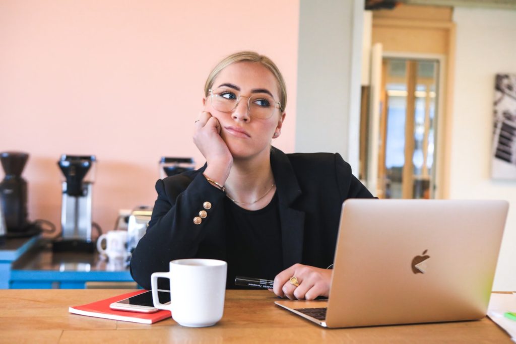 Woman thinking about pros and cons of LLC
