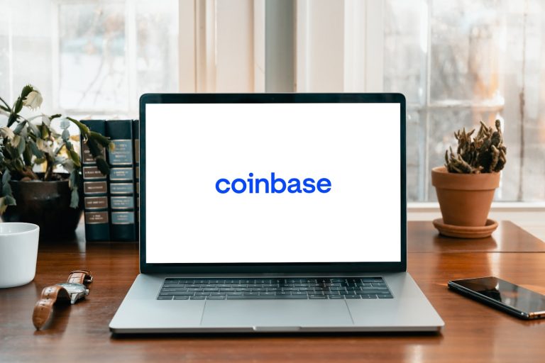 Coinbase logo in a laptop for Coinbase news