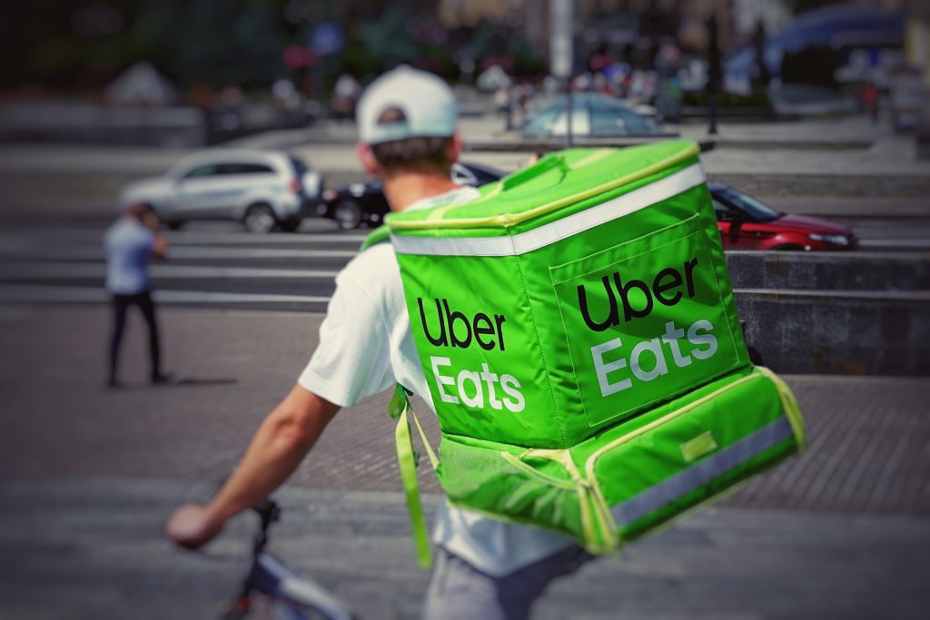 Uber Eats bicycle rider on the road for Uber news today