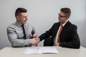 Men handshaking for partnership examples