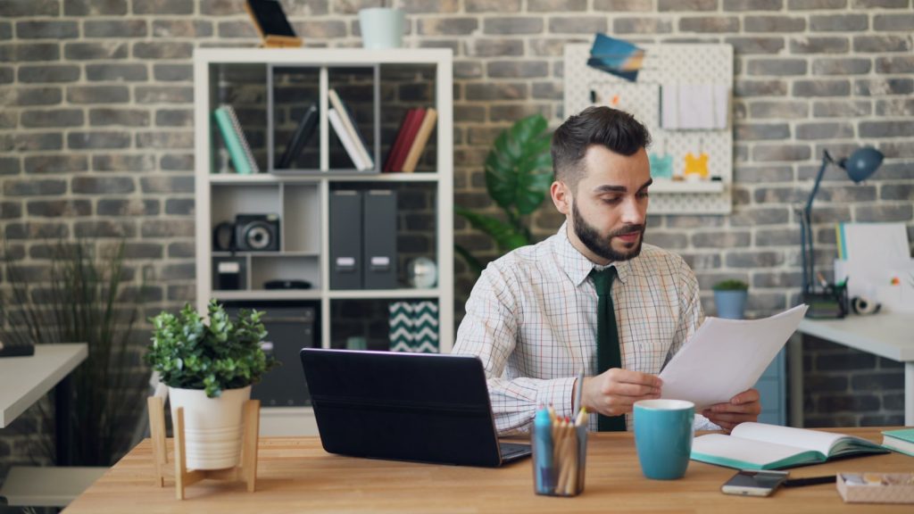 Man reading LLC document