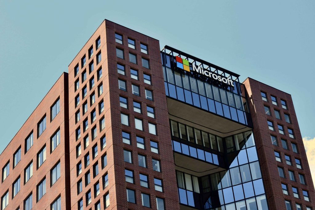 Microsoft office building with company logo on modern glass and brick architecture