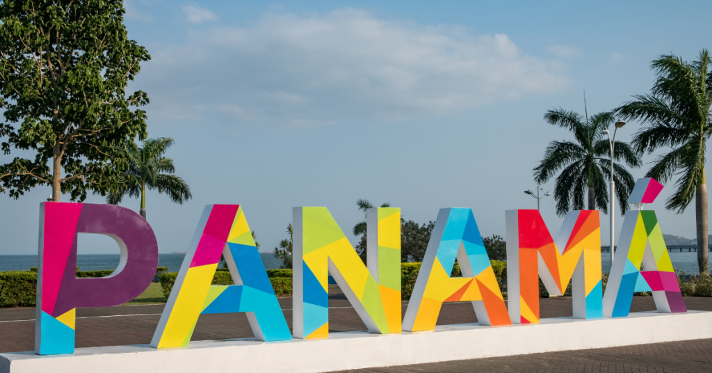 Best Countries to Retire: Beach with a colorful letter display of Panama