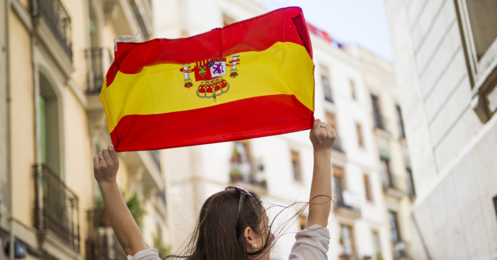Woman holding the flag of Spain