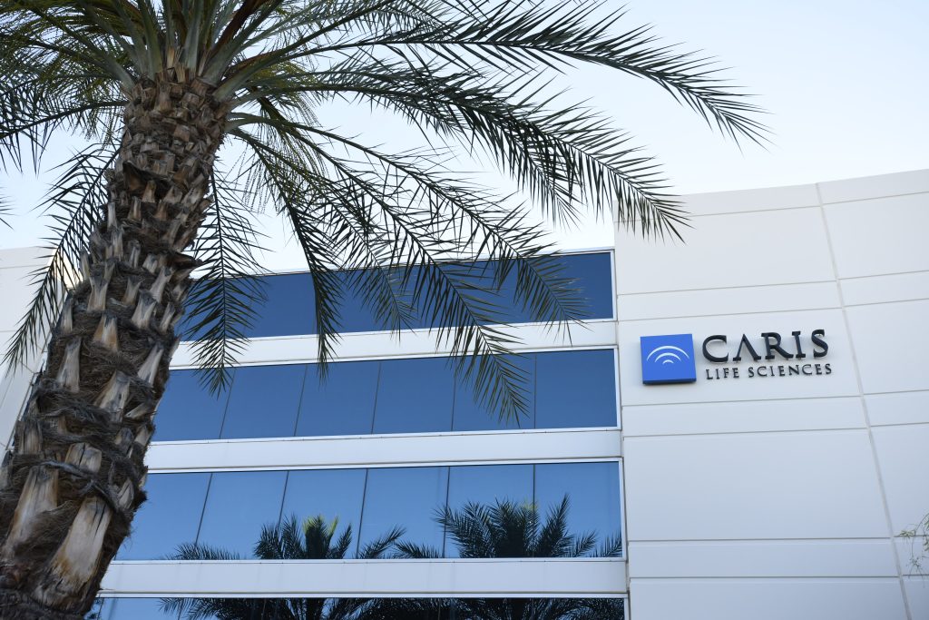 Exterior of Caris Life Sciences tissue lab with a coconut tree in front of the building
