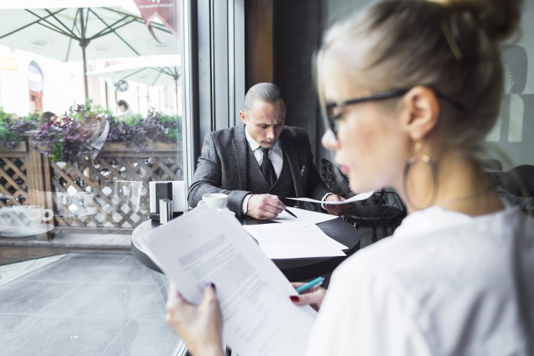 Lady checking documents in structured settlement companies