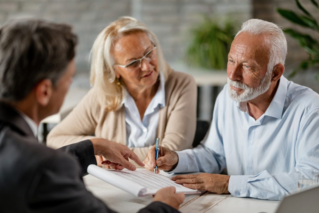 Couple consulting a financial advisor about QLAC