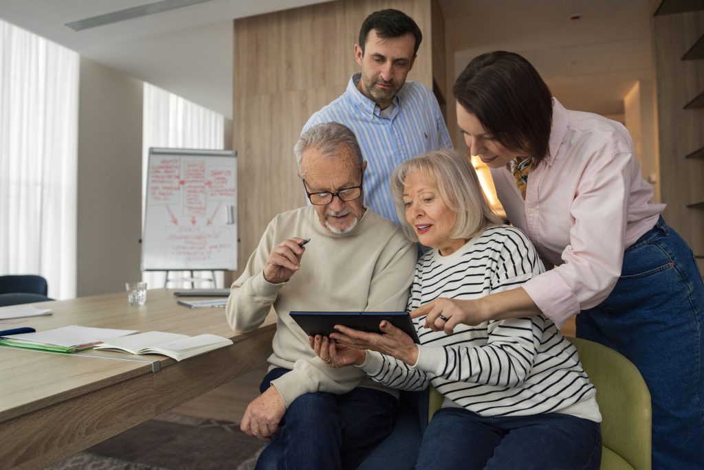 Medium shot of people reviewing life insurance retirement plan