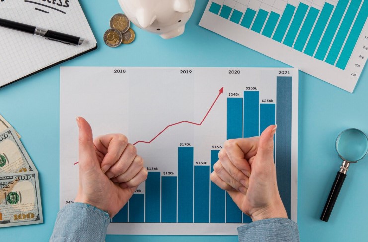Top view of paper with business items with growth trend