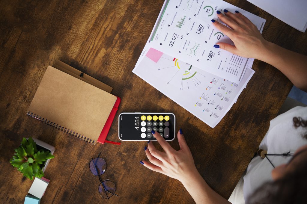 Top view of woman calculating put call parity