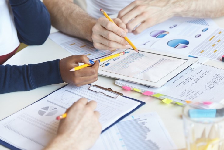 People calculating contribution margin