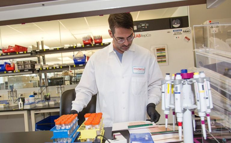 Scientist working in Moderna lab for Moderna news