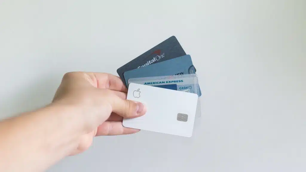 Hand holding charge vs credit card