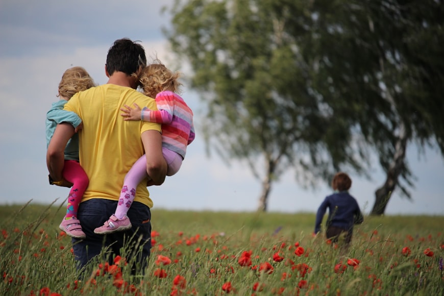 Father carrying his kids