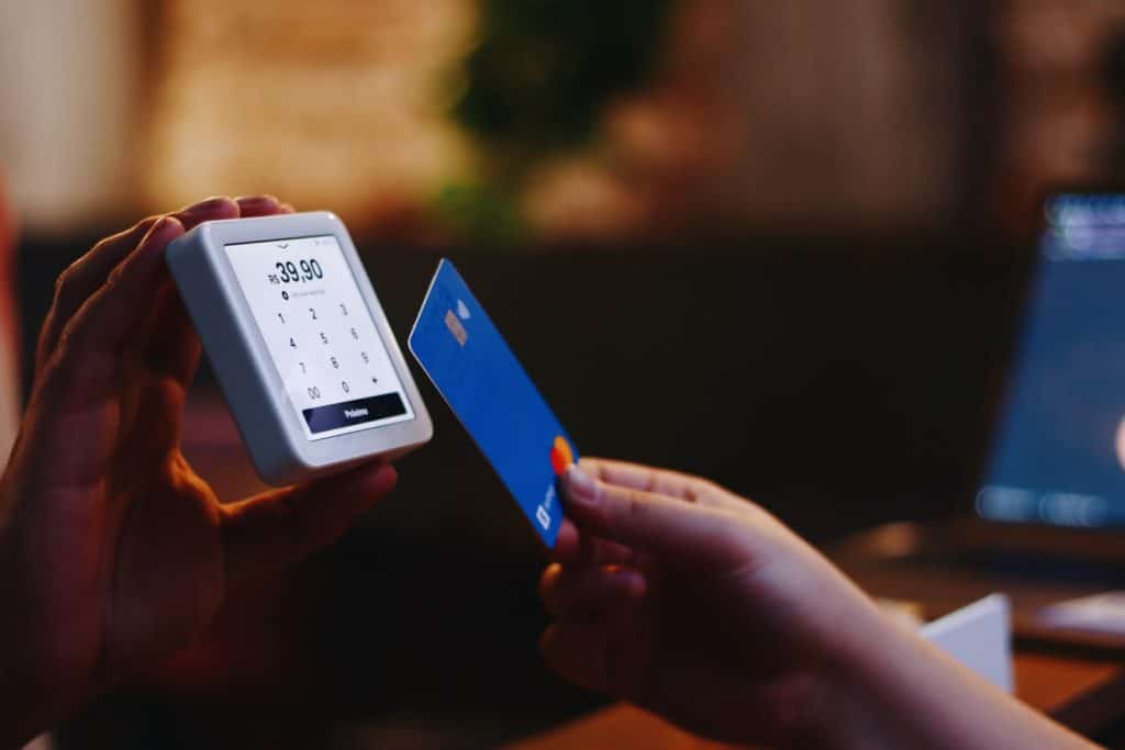 Person paying with charge card or credit card