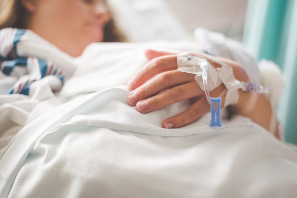 Woman on a hospital bed