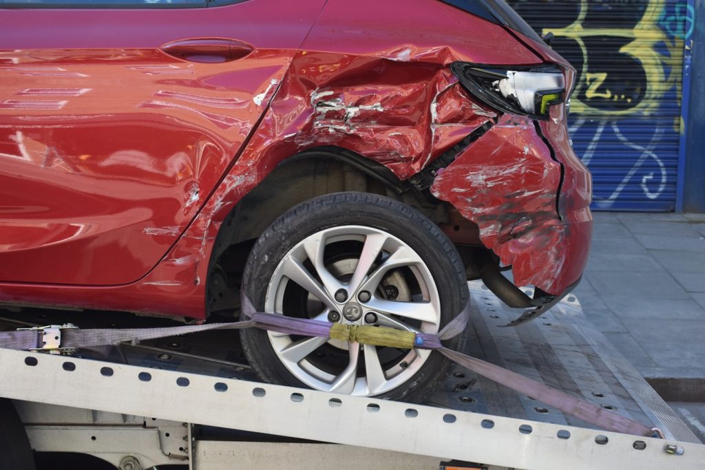 Totaled red car for guaranteed asset protection insurance