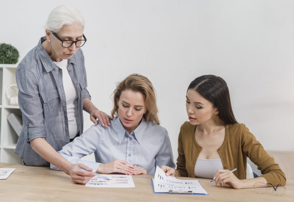 Grandmother discussing legacy planning with her granddaughters