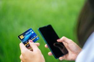 Payment for goods by credit card via smartphone through a payment service provider