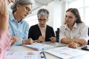 Older people discussing legacy planning with young adults
