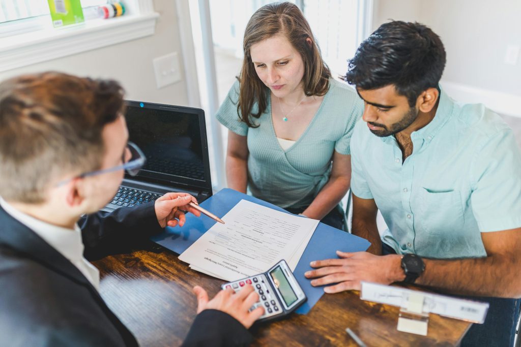 Couple talking to a mortgage lender