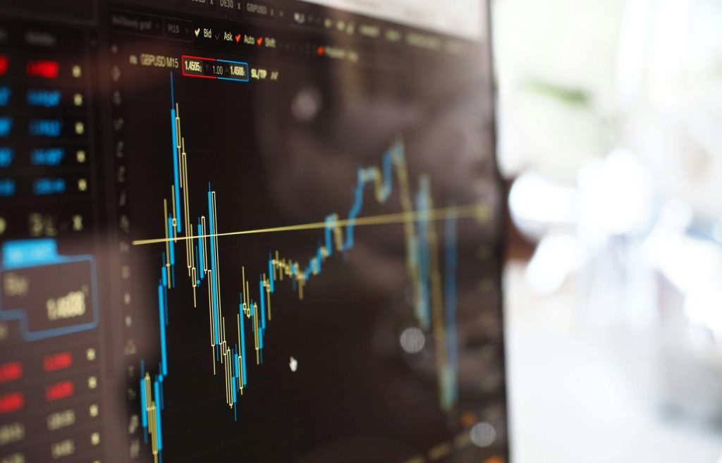 Close-up of trading chart showing candlestick patterns and price movements on a computer screen.