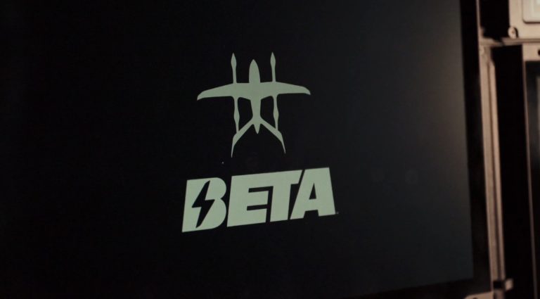 BETA Technologies logo featuring stylized aircraft design and bold lightning-inspired text on a dark background.