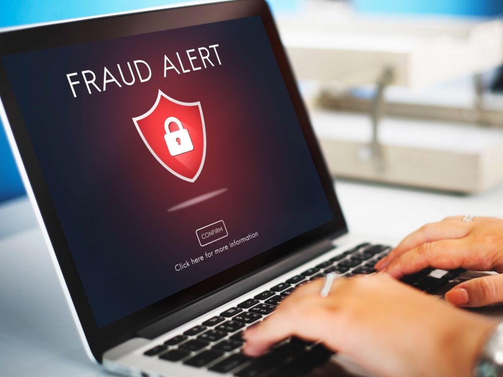 Fraud scam warning for on a laptop screen.