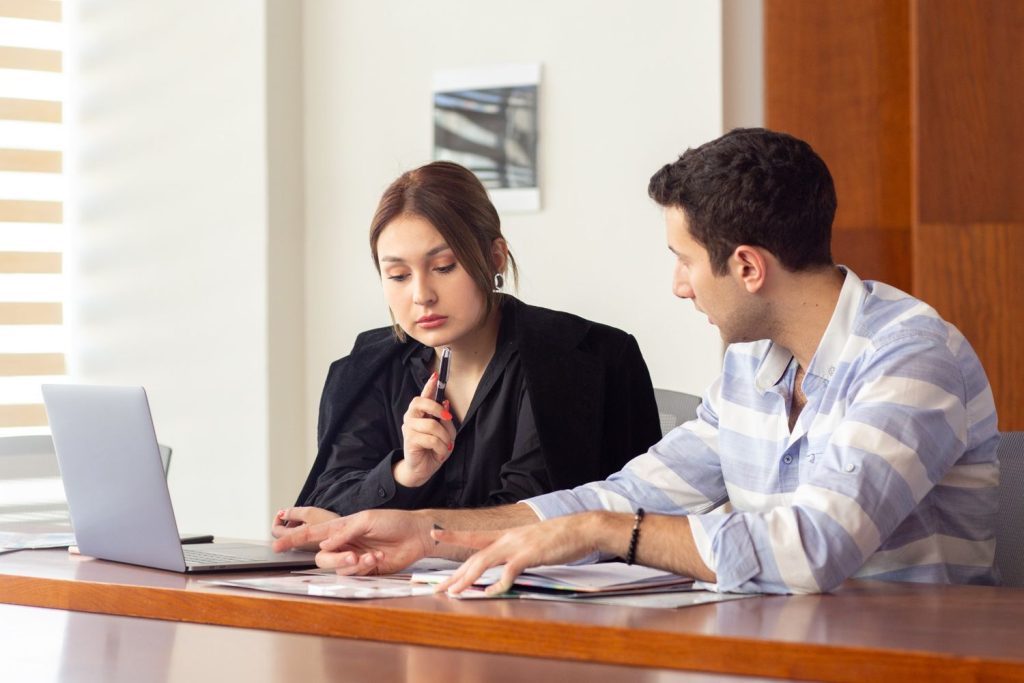 Woman talking to a loan officer about how tog et approved for a personal loan.