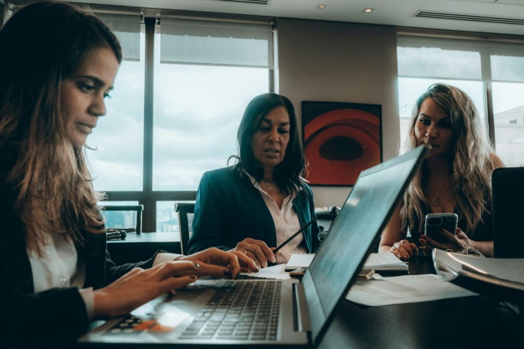 Three loan processors tracking their performance.