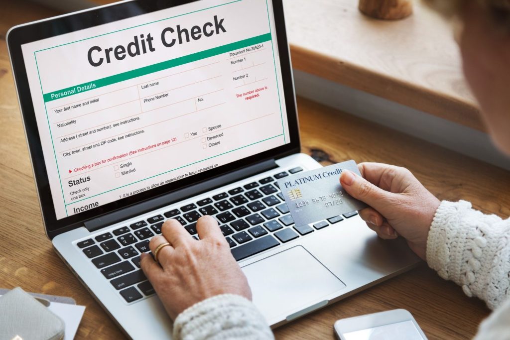 Credit check form on laptop showing hard vs soft credit inquiry process for personal loan applications