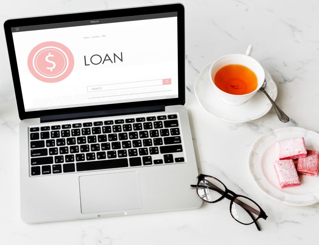 Laptop displaying an online loan search page, illustrating payday loans explained for borrowers.